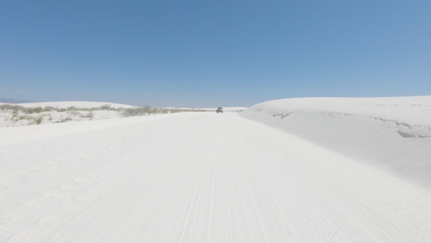 Driving along one of the loop roads in the White Sands National Monument.
When dry, the gypsum sand is snow white, very beautiful. White Sands is a great place for family recreation.
