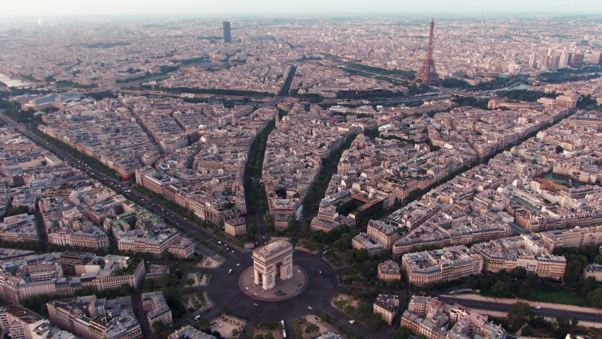 Aerial drone shot of the Skyline of Paris, France with the Arc de Triomphe in the foreground and the Eiffel Tower in the background Royalty-Free Stock Footage #1036004255