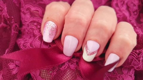 female hand beautiful manicure lace