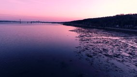 The St-Lawrence river during an incredible pink sunset. Filmed in Quebec, Canada.