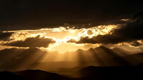 Time lapse of sun rays over the Rocky Mountains