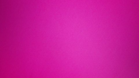 2 wine glasses rolling across a hot pink background from different angles. Two glasses rolling on and off screen. Top to bottom then left to right. Rolls down.