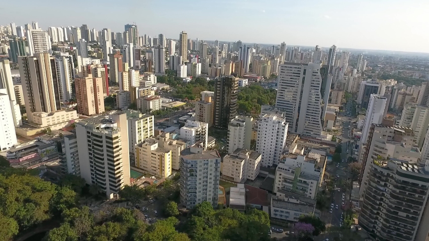 Aerial view of Goiania city sierra, Goias state, Brazil. Lakes, houses and many buildings.