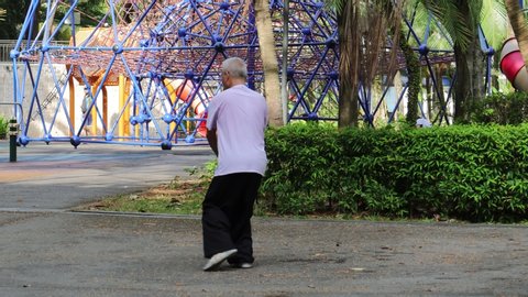 Woodlands / Singapore - August 29th 2019: An old man is practicing tai chi a rest at the park.