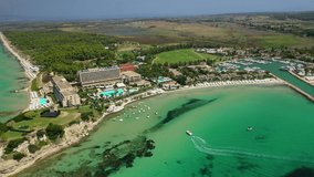 Aerial drone video from iconic village and resort of Sani with unique nature in North Kassandra peninsula, Halkidiki, North Greece