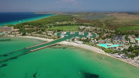 Aerial drone video from iconic village and resort of Sani with unique nature in North Kassandra peninsula, Halkidiki, North Greece