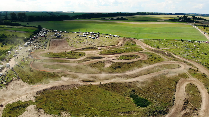 Concept of adrenaline, excitement, smell of gasoline and dust. Motocross is a sport for strong spirit people. Aerial survey of the track for motocross.