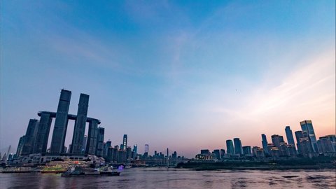 Chongqing/ China - August 15th 2019 :time lapse of chaotianmen and the Yangtze River in chongqing, china. from day to night.
