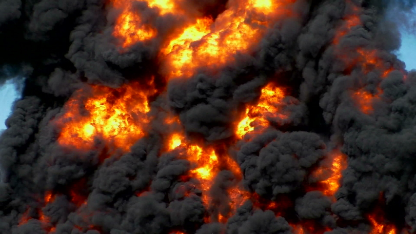 Explosive burning petroleum. A powerful Fire at an oil well is beautiful and dangerous for people and the environment. Royalty-Free Stock Footage #1036052564