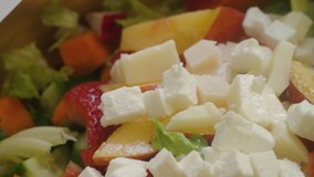 Cut Almond nuts slide off a cutting board into a freshly made summer salad - Powered by Shutterstock - Get 15% off with code: PIKWIZARD15