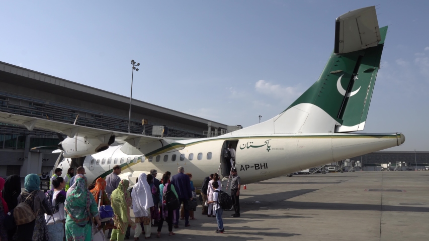 At Islamabad Airport Passengers are Waiting Outside for Boarding the Pakistan International Airlines Plane to Gilgit