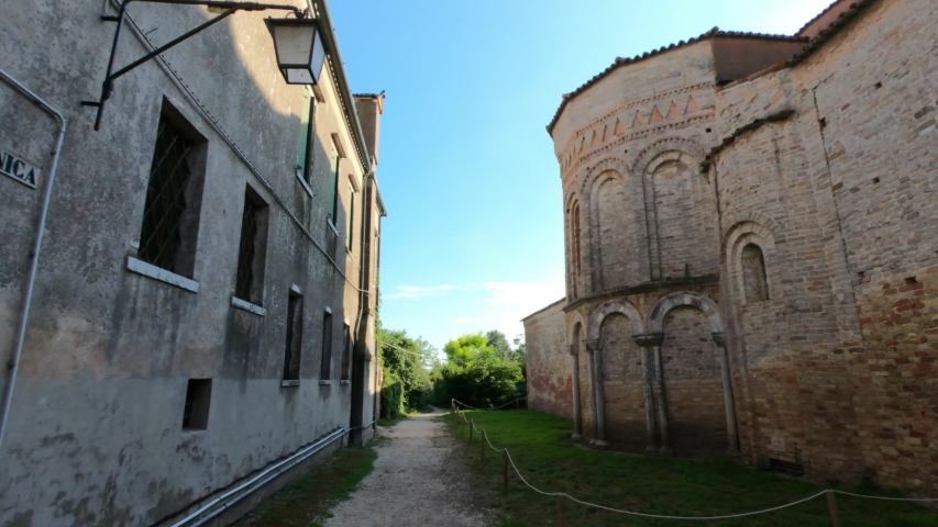 PAN SHOT - The Church of Santa Maria Assunta is a basilica church on the island of Torcello, Venice, northern Italy. It is a notable example of Venetian-Byzantine architecture.