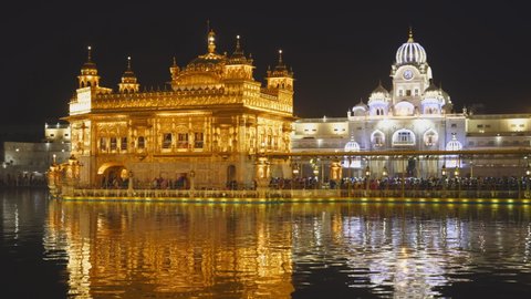 a close view of the beautiful sikh golden temple at night in amritsar, india
