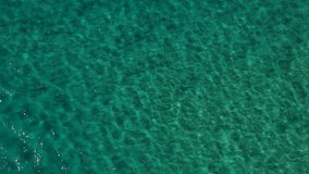 Aerial view of clear water rippling in the ocean currents