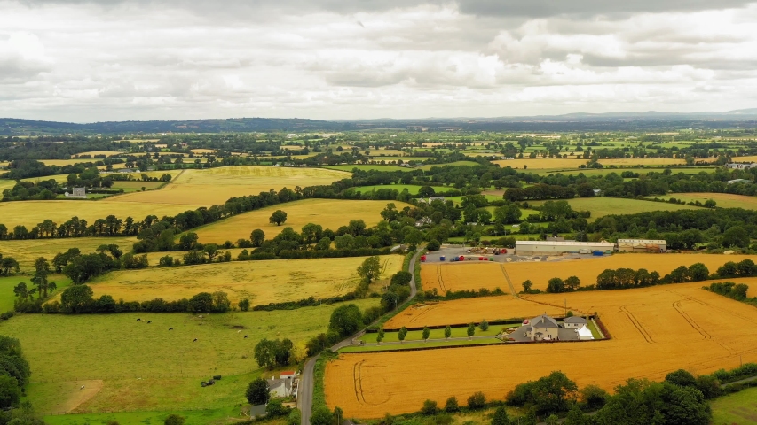 Aerial drone view of Irish countryside and farmlands near the Carlow in Dublin county, Ireland. Rural Irish landscape.