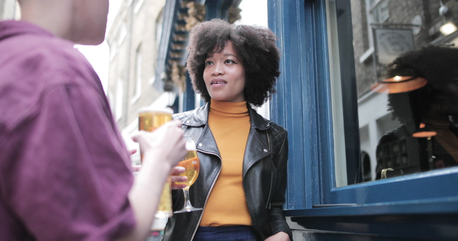 LBGTQI friends having a drink at a bar