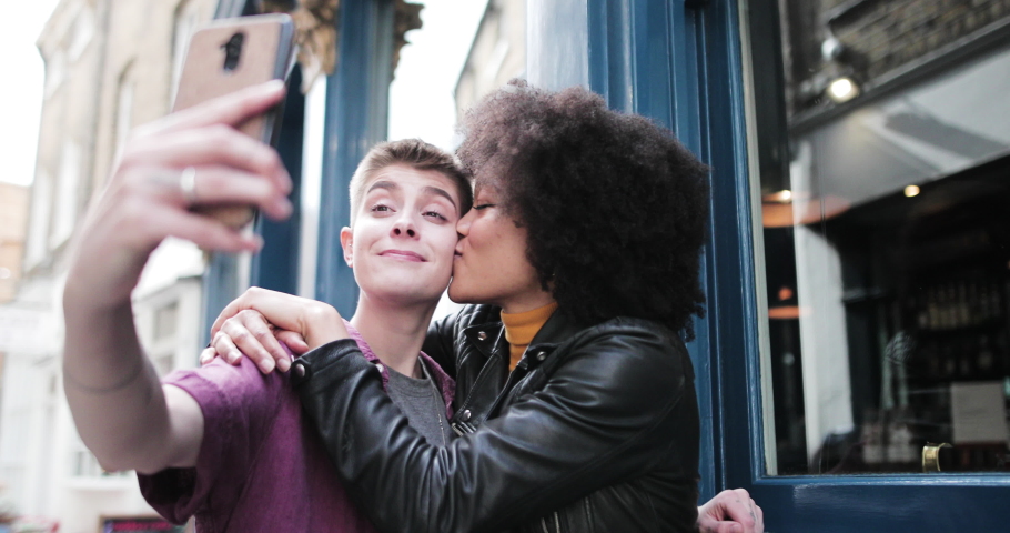Young adult lesbian couple taking selfie in London Royalty-Free Stock Footage #1036103516