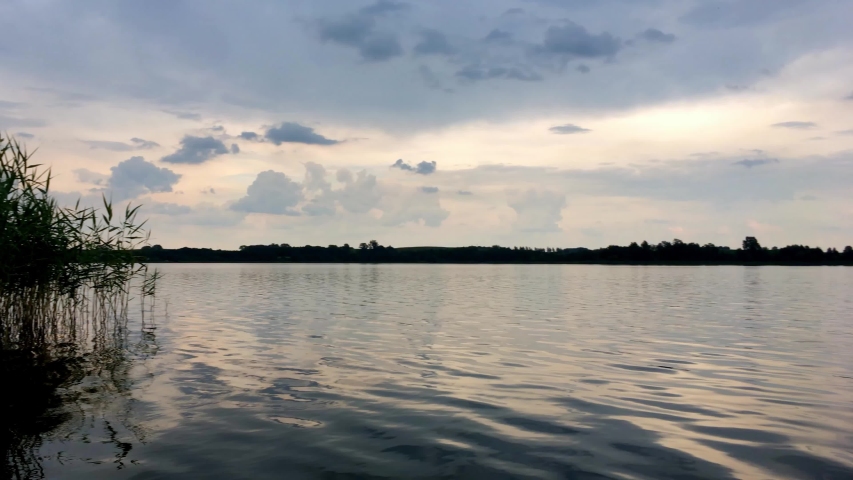 Lake Timelapse. Timelapse Of A Peaceful Lake And Mooving Clouds. Motion Timelapse Left To Right Pan. Storm Coluds Over A Lake.