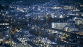 KYOTO, JAPAN, Bullet trains and commuter trains converging at twilight, heading towards Train station. Tourism and Transportation Timelapse.