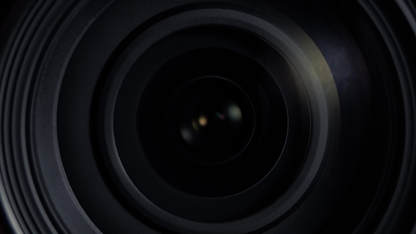 Focusing lens of digital camera. Camera lens zoom. Changing focal length. Close-up Camera Focus Focusing And Shooting. Concept of proffesional service for photographic or filmmaker equipment.