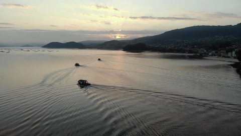 Aerial view of mussel-boats distributing towards the mussel beds at dawn
