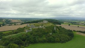 Wide cinematic 4K aerial panning shot, the Rock of Dunamase, Portlaoise, Ireland.