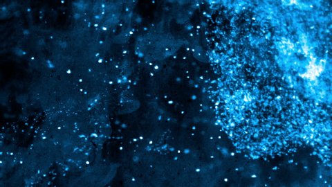 Bright and blue particles floating on a smoky nebulous dark background - full hd