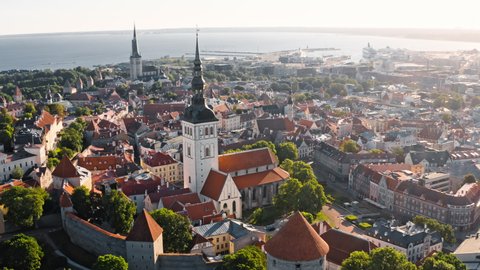 Tallinn, Estonia: morning drone view of Walls of Tallinn and St. Nicholas' Church in old town