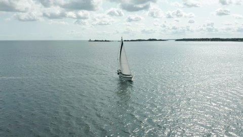 Aerial view of sailboat crossing the sea. Boat sailing the archipelago.