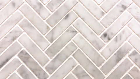 Arrow pattern of decorative stone marble tiles used for the floor or wall kitchen and bathroom remodel decoration. Marble tiles are used as a kitchen backsplash too.