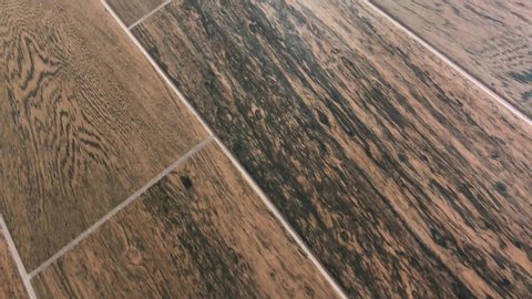 Diagonal floor tile pattern of the ceramic or porcelain tiles. Kitchen or bathroom flooring concept.