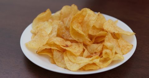 Potato chip on white plate, party time