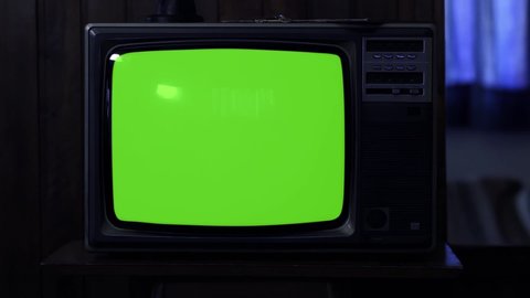Old TV Turning On Green Screen with Color Bars. Night Tone. You can replace green screen with the footage or picture you want with “Keying” effect in AE (check tutorials in YouTube).