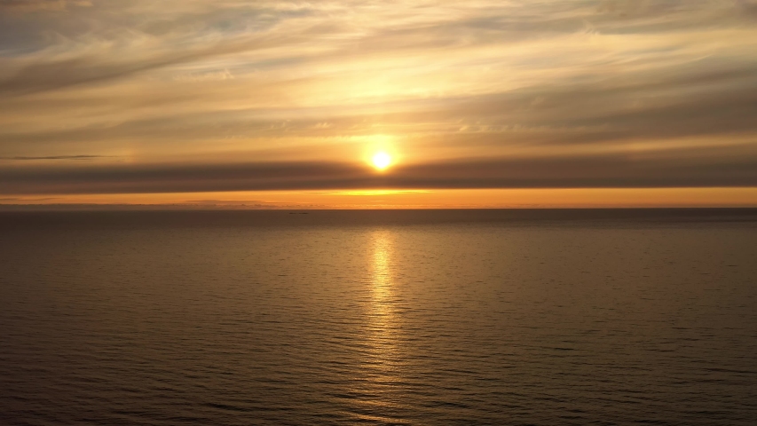 Aerial view of a beautiful sunset over the sea. Beach Lofoten archipelago, Norway.