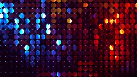 Colorful sparkles shining reflective background. Abstract kinetic glitter wall moving. Night club decoration. Can be used as transitions, added to modern projects,art backgrounds.