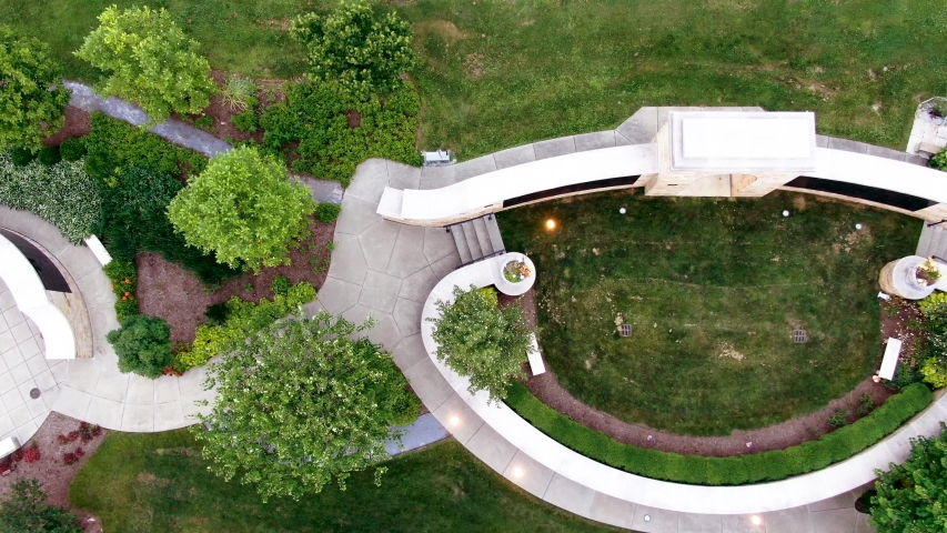 Aerial drone tilt-up backward reveal shot of the graves and structures in Woodward Hill Cemetery in Lancaster, Pennsylvania, USA