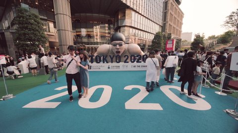 Tokyo, Japan - August 25,2019: Event for Tokyo Olympic Games in 2020. In the Tokyo Midtown Hibiya of Tokyo stood a huge inflatable structure in the shape of a swimming athlete in action.