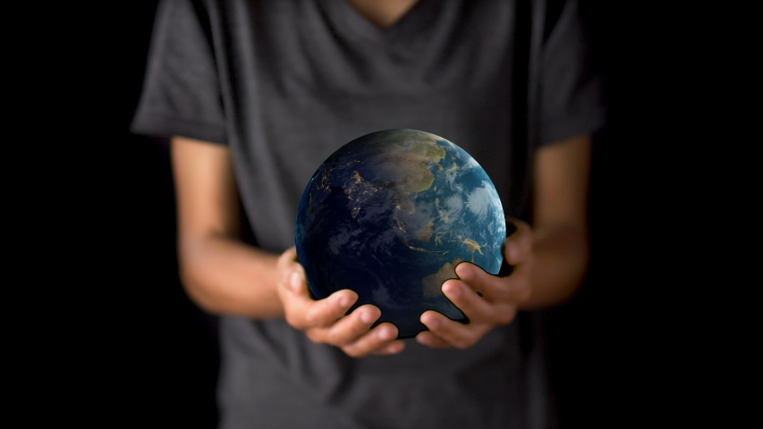 Female hand holding a realistic Earth. Holding the world in your hand. Rotation planet. Earth globe. World map design. Global sphere planet. Texture map courtesy of NASA.
