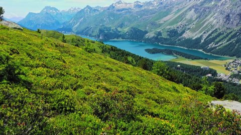 Amazing view over Lake Sils and the Engadin region in Switzerland - aerial timelapse shot