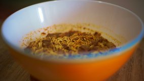 4K video of instant noodle in the bowl.
