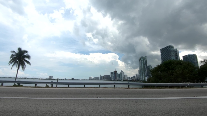 4K: Driving on Julia Tuttle Causeway bridge inside car view of Miami Downtown