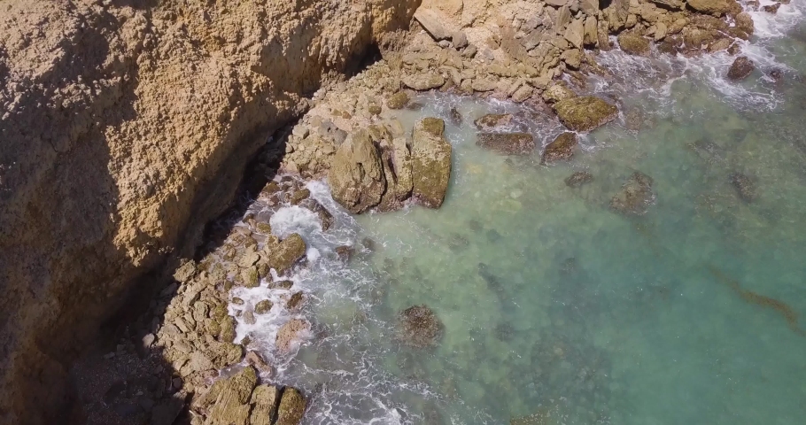 Drone captures beautiful cinematic footage of Puerto Rican beach and light house in Cabo Rojo PR