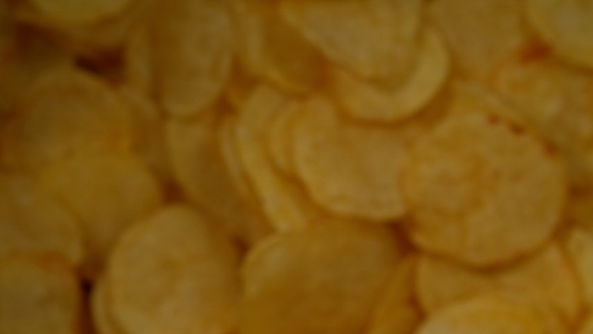 Super Slow Motion Shot of Potato Chips Flies After Being Exploded against Black Background, 1000fps. | Shutterstock HD Video #1036230935