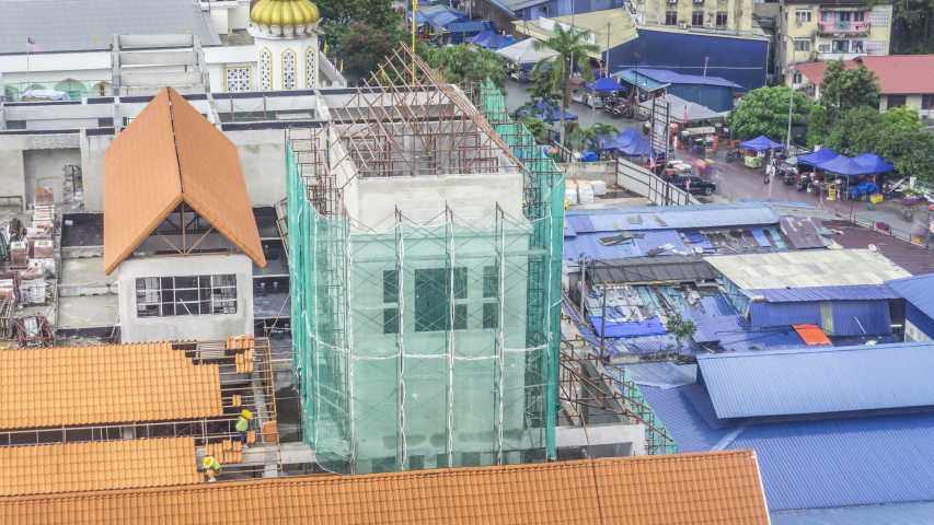 Construction site, workers are working, located in Kuala Lumpur, Malaysia.