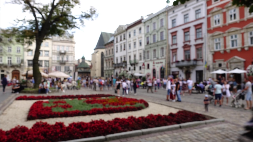 Crowds of people on city streets. Time lapse,  out of focus.