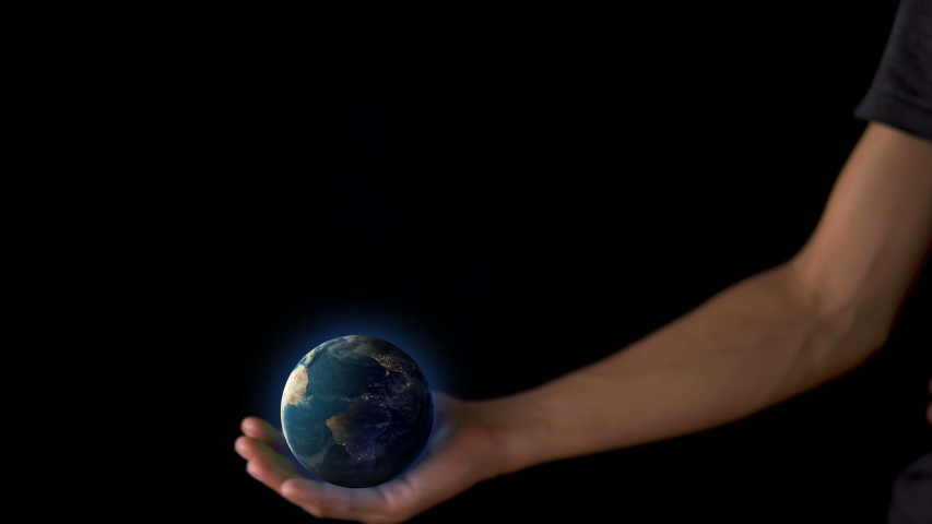 Female hand holding a realistic Earth. Holding the world in your hand. Rotation planet. Earth globe. World map design. Global sphere planet. Texture map courtesy of NASA.