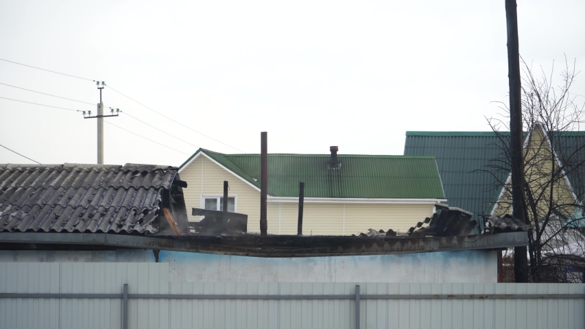 Burned down smoking buildings in the village