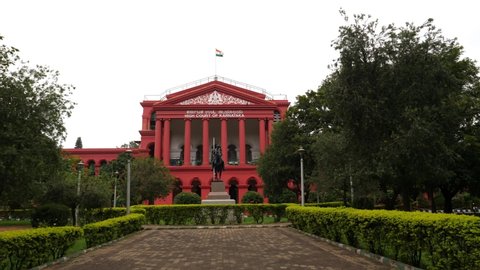 Bengaluru, Karnataka / India - September 1 2019: Wide angle view of the Karnataka state high court on a cloudy day with the Indian flag hoisted on top