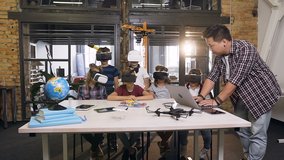Korean teacher with group young pupils with laptop and VR headsets during a computer science class. Excited schoolchildren's of primary school using augmented reality for studying in modern school - Powered by Shutterstock - Get 15% off with code: PIKWIZARD15
