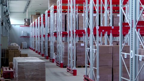 Modern, spacious, large warehouse storage and consolidation of goods. Racks are filled with boxes
